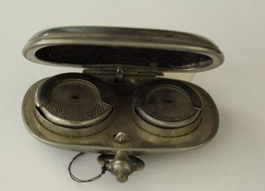 Small silver case with fob clip designed to hold sovereign and half sovereign coins,