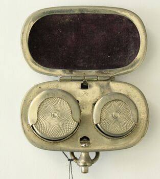 Inside of sovereign holder showing velvet lining and spring loaded coin section