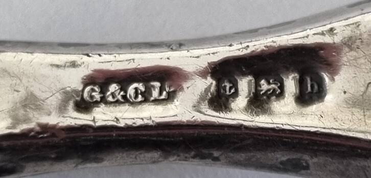 Hallmark on one side of implement