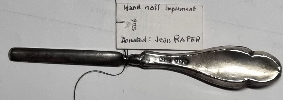 Manicure implement with donation tag