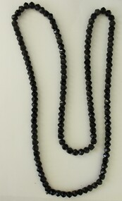 A long string of black beads.