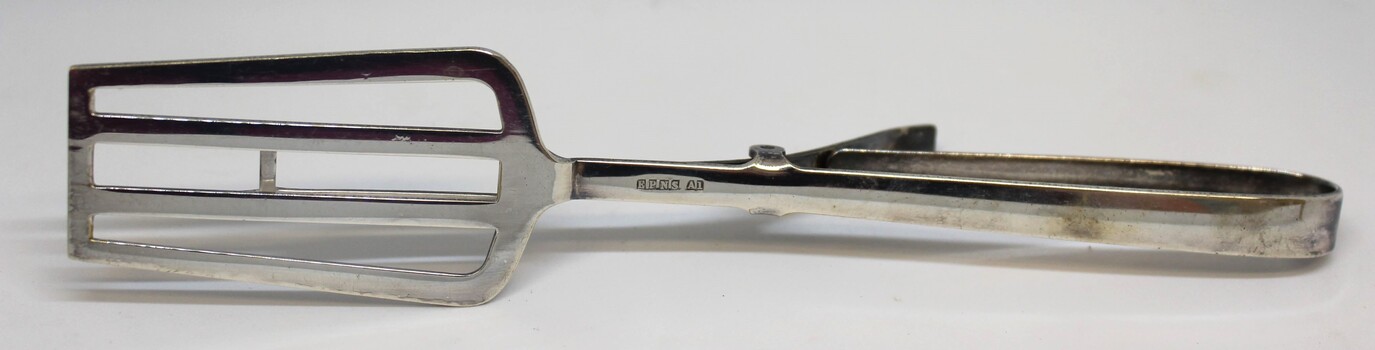 Side view of tongs showing position of hallmark