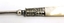 Decorative silver work on shaft between the handle and fork blade