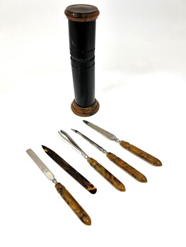 Manicure set in cylindrical case and 5 implements