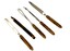 Manicure set items including nail file, tweezers and shaping tools
