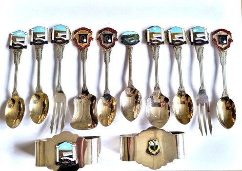 Collection of silver and gold spoons and napkin rings 