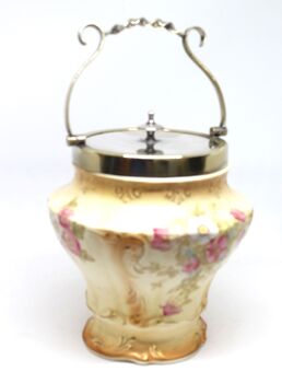 Biscuit barrel showing handle raised upright