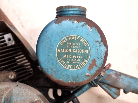 Fuel tank with instructions on side.