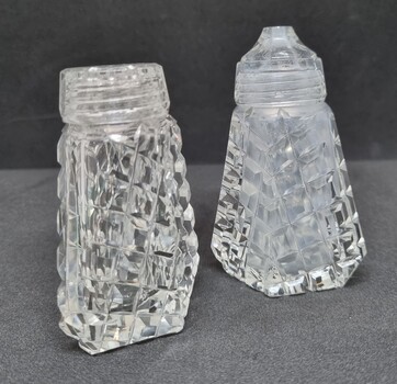 A set of crystal salt and pepper shakers.