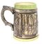 Reverse of beer mug with door / shield design and green trim at base and lip.