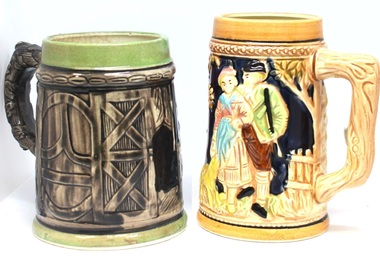 Pair of beer mugs of differing designs