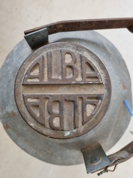 Detachable lid of petrol can showing the company name "ALBA"
