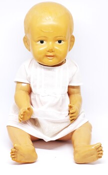 Large celluloid doll with cotton and lace dress