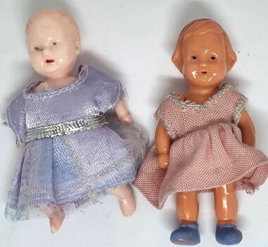 Miniature Celluloid dolls in hand made clothing