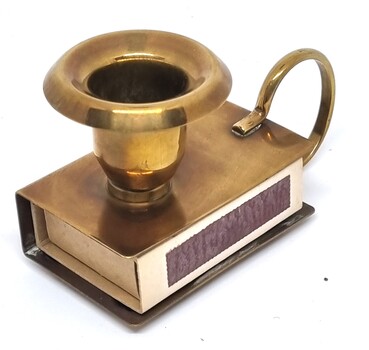 Match box and candle holder showing match box