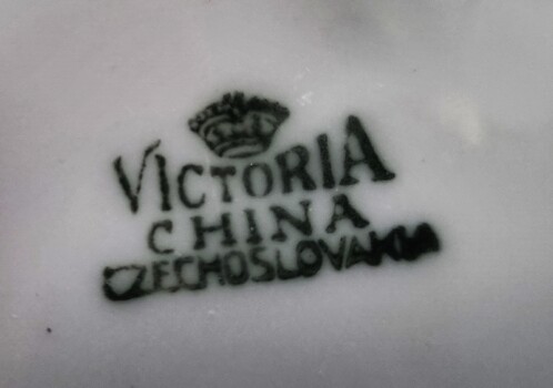 Black maker's mark of Victoria China underneath plate