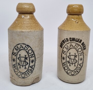 2 earthenware bottles bearing the name and logo of S. Mason, Wodonga