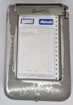 Business docket dispenser including a docket for Mann's Mitre 10
