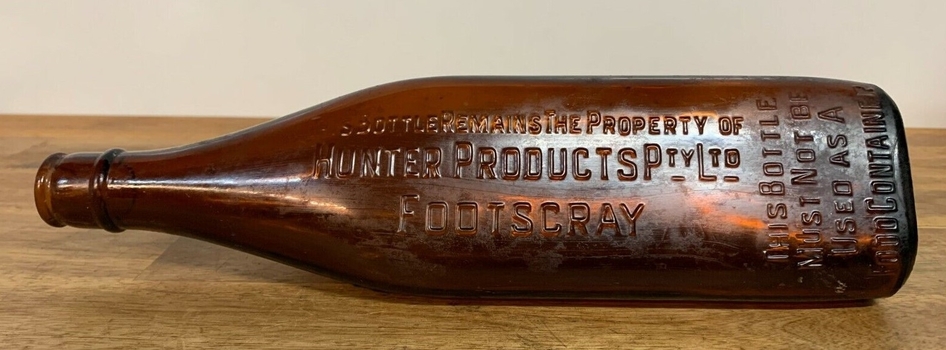 Imprint of Hunter Products manufacturers embossed on bottle
