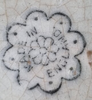 Maker's mark showing flower and words Made in England