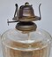 Wick and brass regulator to modify flame.
