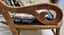 Side view showing carved armrest