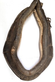 Hand made horse collar made from leather,  metal buckles and fabric and stuffed with straw