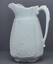 White ironstone china jug with leaf design.