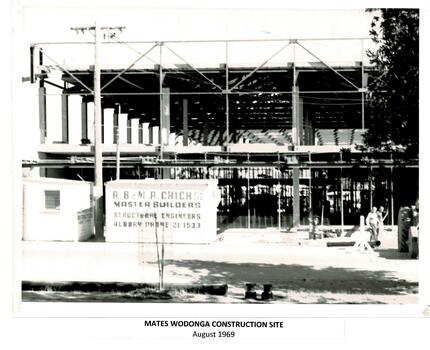 Mate's store under construction. Builders sign on fence A.B & M. B Chick