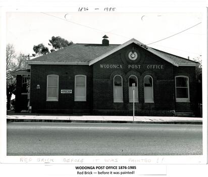 A red brick building with large windows and the name Wodonga Post Office