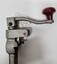 Top of can opened showing red rotating handle and blade attachment