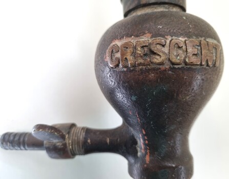 Crescent brand name imprinted on connecting section of handle and showing hose attachment