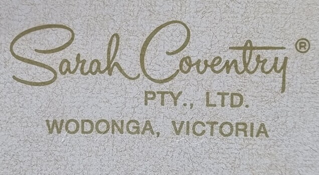Logo of Sarah Coventry on top of box