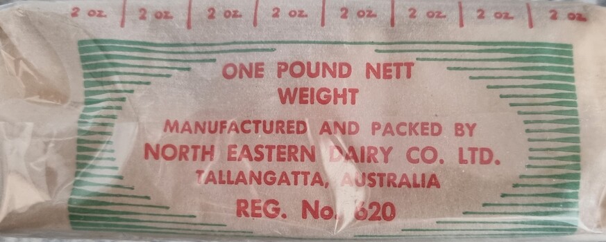 Side view of Tallangatta Butter showing measurement scale in ounces