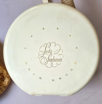 Lid of dryer unit showing Lady Sunbeam Brand name