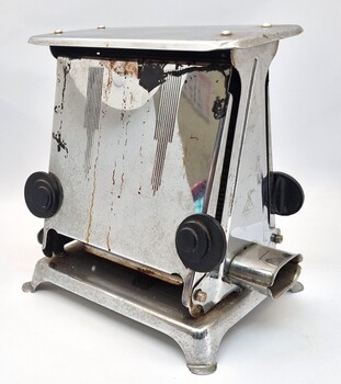 Hecla toaster showing side view, opening knobs and electricity socket