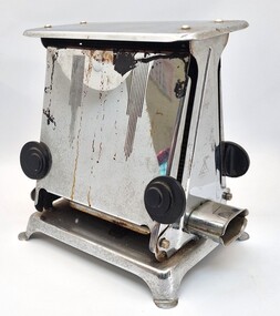 Hecla toaster showing side view, opening knobs and electricity socket