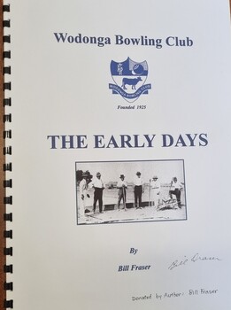 Front cover showing Club logo and a photo of a group of men 
