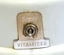 Semak logo surrounding the power control on front of base.