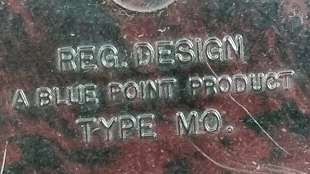 Manufacturer's name inscribed under ashtray