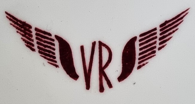 Maroon Logo of VR in between stylised wings.
