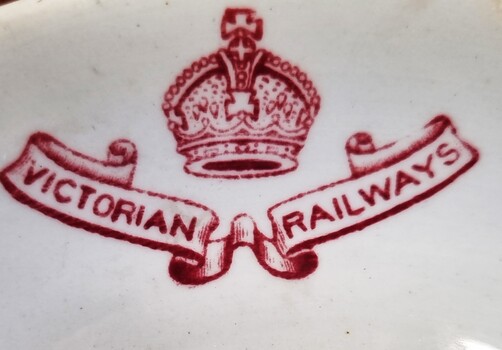 Red insignia of Victorian Railways on edge of bowl