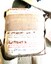 Chemical tank held in khaki webbing strap harness