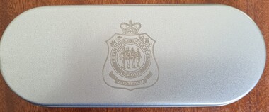 Metal tin bearing the insignia of Returned Services League of Australia