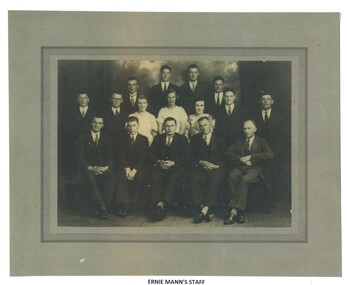 Photo of Mr. Ernie Mann and his staff in formal photo