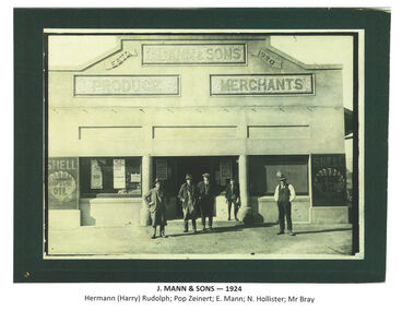 Image of staff of J. Mann & Sons standing outside the business