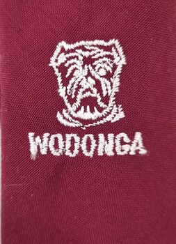 White embroidered bulldog on tie