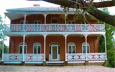 Front view of de Kerilleau Homestead featuring ornate verandah.