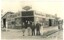 4 staff members standing outside the premises of A. L. TOOLE.