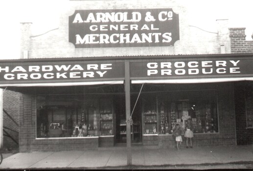 2 Children outside Arnold's General Merchants Store